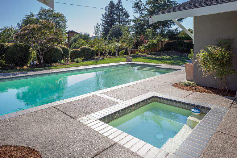 Stand-Alone in-ground Jacuzzi next to Pool.