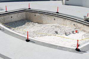 A drained pool under construction at a resort