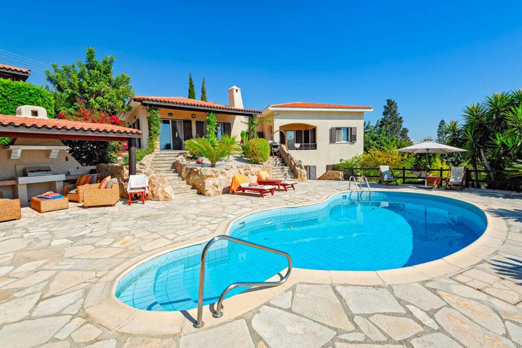 Private swimming pool and patio area outside Cyprus villa